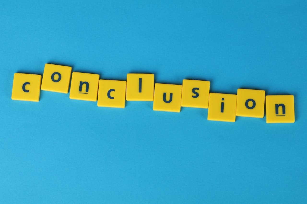 Home Yellow letter tiles spelling 'conclusion' on a vibrant blue background emphasizing creativity and achievement.